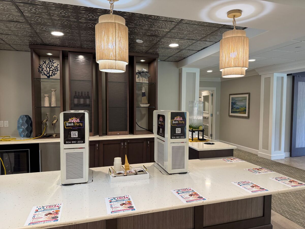 Two Bash soft serve machines set up for an employee ice cream social in an office lounge